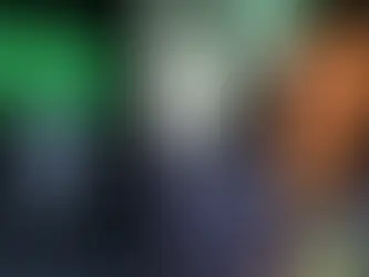 Xbox console with "THIS IS AN XBOX" text in green on left; smiling Sarah Bond in denim jacket with name tag on right. Mood is cheerful.