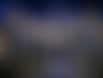 Team Spirit members in black jerseys holding trophy on stage at Intel Extreme Masters IEM Cologne 2025. Bright lights and confetti in the background, mood is celebratory.