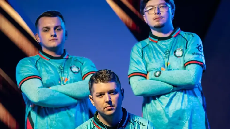 Three men from Twisted Minds in teal jerseys pose confidently with crossed arms against a blue background. Jerseys feature logos and a circular design.