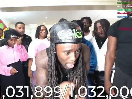 Kai Cenat, on a Twitch live stream celebrating the 1 million subs milestone with fellow streamers and friends.