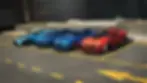 Four sports cars, two blue, one light blue, and one red, parked in a row on a rooftop. City buildings in the background. its from The Crew.