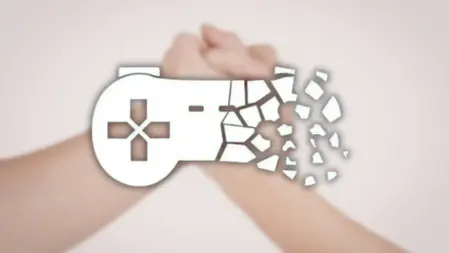 Two hands clasped in unity, with a white video game controller icon partially shattered overlaying. Soft pink background.