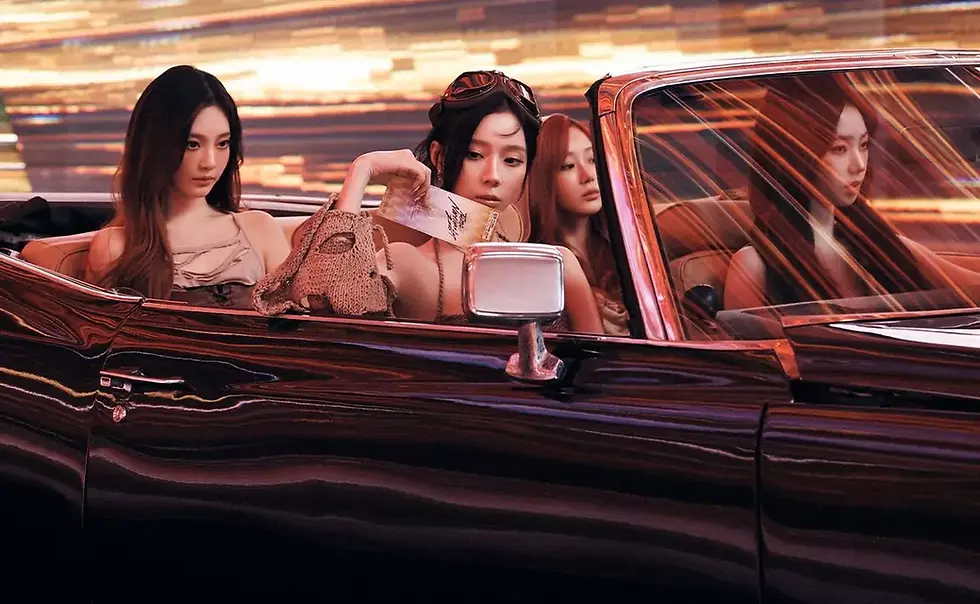Four women, Karina, Winter, Giselle, and Ningning, from aespa, sit in a vintage convertible with blurred city lights. One holds a card. Mood is stylish and reflective.
