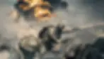 Battlefield 6 video game Soldiers in camouflage gear advance under fire beside a tank, with an explosion and smoke in the background, creating a tense atmosphere.