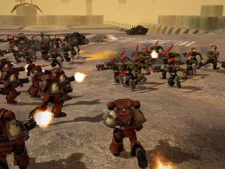 Armored soldiers in red fighting green orcs with weapons on a barren, industrial battlefield. Muzzle flashes and a sense of combat intensity. its RTS gameplay of Warhammer 40,000: Dawn of War - Definitive Edition.