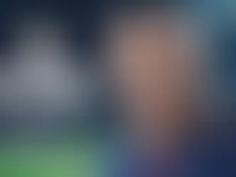 EA Sports FC26 cover features close-up of Zlatan Ibrahimovic soccer player in a dark blue jersey. Stadium background with blurred crowd.