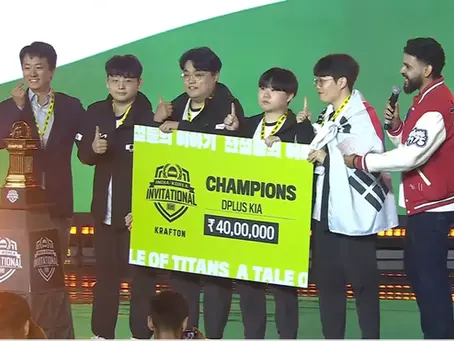 Esports team holds a large yellow check for ₹40,00,000 as champions at India-Korea Invitational. Trophies and green backdrop visible.
