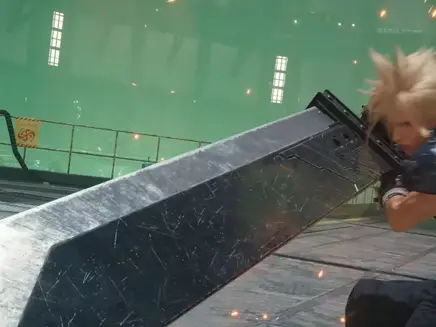 A Final fantasy character with spiky blond hair wielding a large sword in an industrial setting. Greenish glow, sparks in the air, "Caution" sign visible.