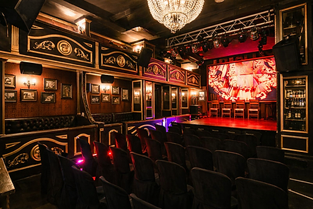 Interior of Teatro Club in Malaga, Spain, with stage, chandelier and theatrical atmosphere, featured in Malaga Pub Crawl