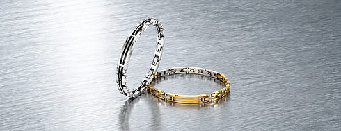 Bracciali da uomo Comete Gioielli della collezione Black & Gold in acciaio, con dettagli color oro e neri.