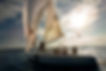 Group of friends on a sailing boat at sunset on the sea during a bachelor parte organised by Pub crawl Malaga, Spain