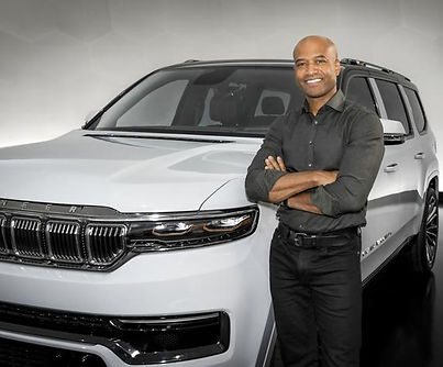 Ralph Gilles Standing in front of a Jeep Wagoneer