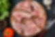 top-view-fresh-meat-slices-raw-meat-with-greens-tomatoes-dark-kitchen-meal-food-cow-food-d