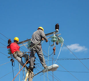 low-angle-shot-electric-linemen-working-pole.jpg