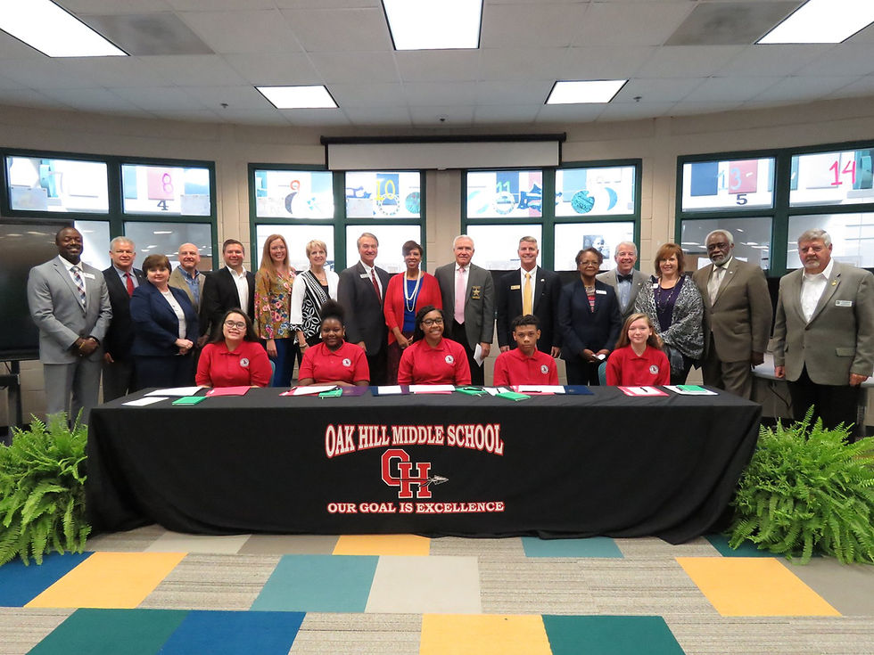 REACH Scholars flanked by local community leaders.