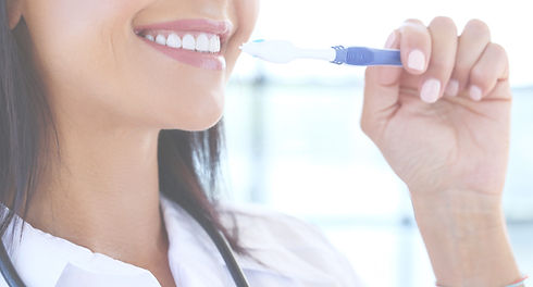 doctor-using-toothbrush_edited.jpg