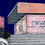 Thumbnail: Grey and white concrete stairs artwork with pink building and dark blue sky