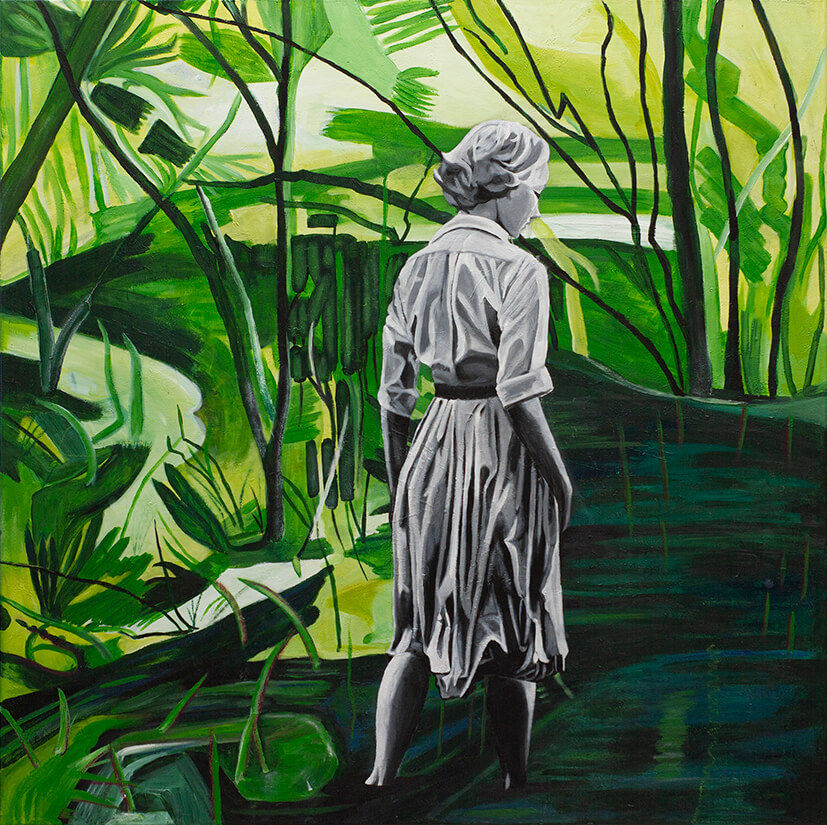 Woman in dress, in black and white,  standing in dark water between green plants and leaves