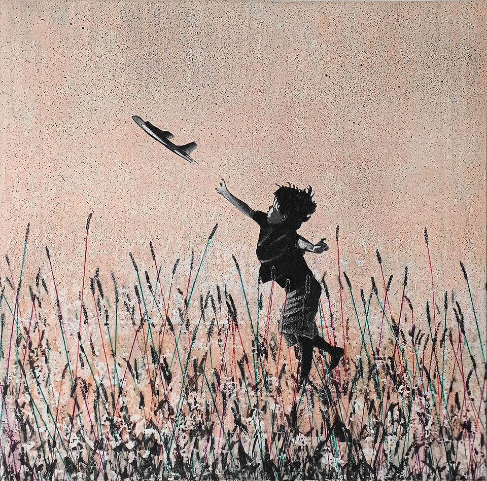 mixed media landscape with monochrome boy standing in black reed pretending throwing real plane in peach sky