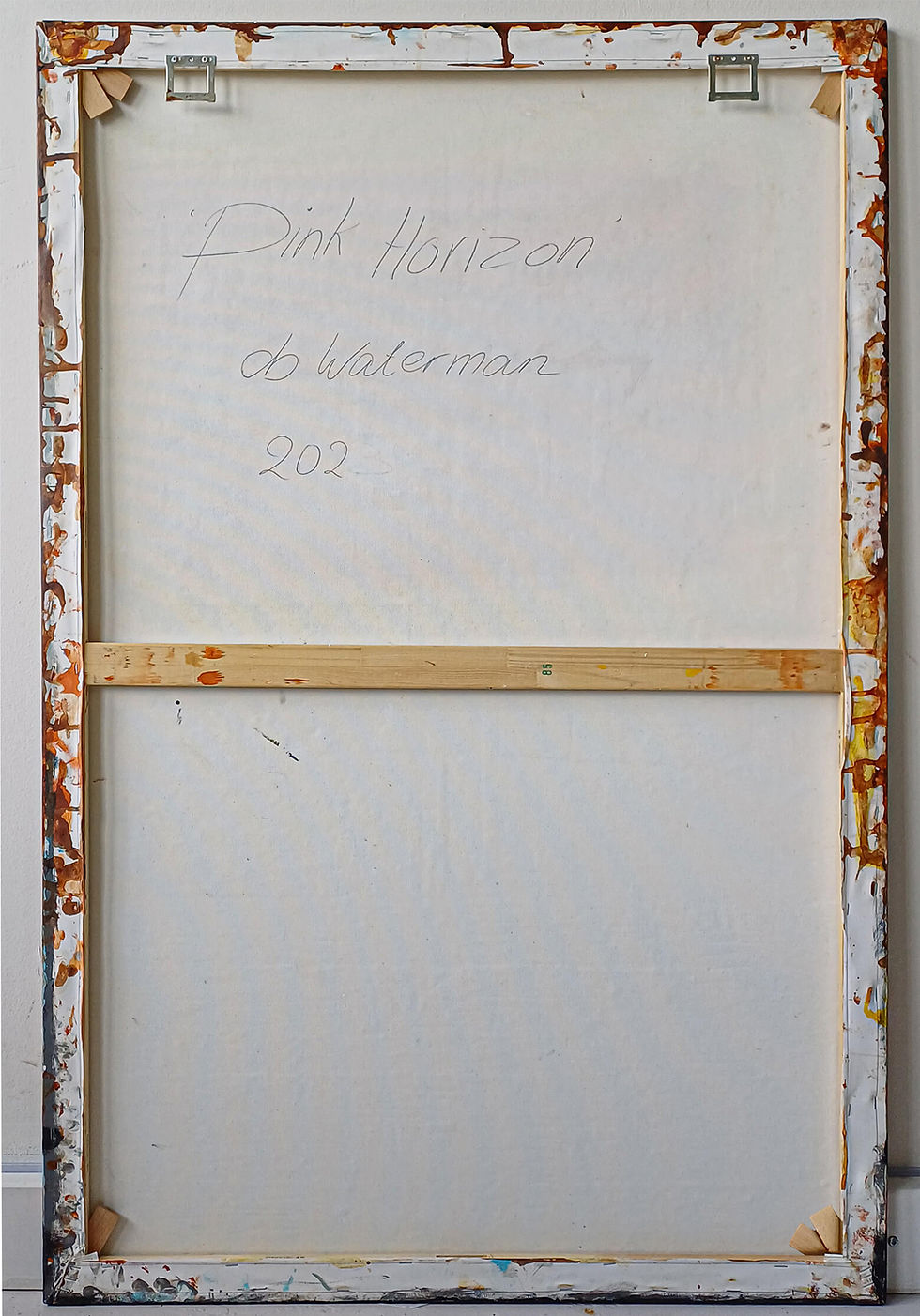 Thumbnail: Back of canvas 'PINK HORIZON' with wooden frame and db Waterman signature