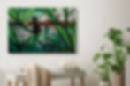 Artwork with black silhouette child playing behind transparent leaves with industry in the back, hanging above white bench