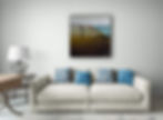 on white wall above light sofa with blue cushions, a square seascape with silhouette of running girl in brown, beige,green