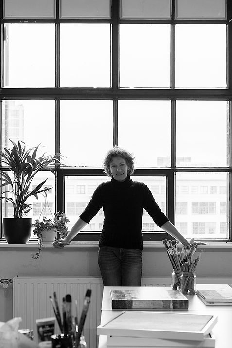 db Waterman standing in front of window in studio art gallery Strijp S,Eindhoven.