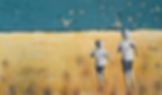 Two monochrome boys run through golden yellow dunes towards the sea with dark blue-green sky and lots of seagulls