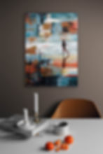 Interior with blue white wall and abstract beach art with running boy hanging on the brown wall above table