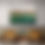 Thumbnail: art above table and wooden chairs, of abstract landscape in a light-colored section with a rusty fence and a green urban part