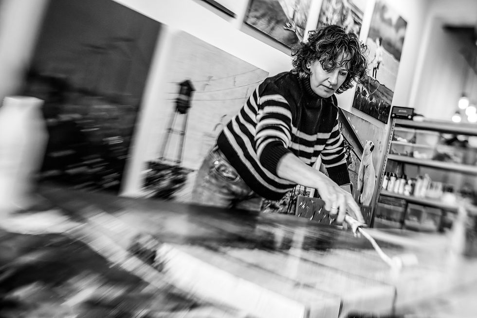 Black and white photo of db Waterman at work in her studio at Strijp-S Eindhoven