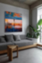 Square painting with boy running on beach in warm orange and blue tones, hanging above grey sofa seen from the left