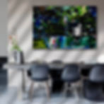 Horizontal green, blue and pink water and woods landscape on white wall, above table with dark chairs