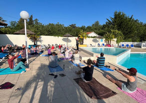 Psalms & Stretches by the pool, people stretching on towels