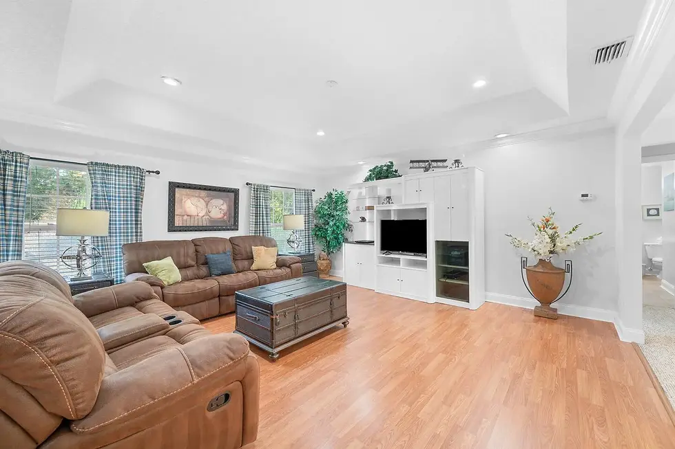 St. Augustine vacation rental living room with leather recliners and fireplace ideal for STR management
