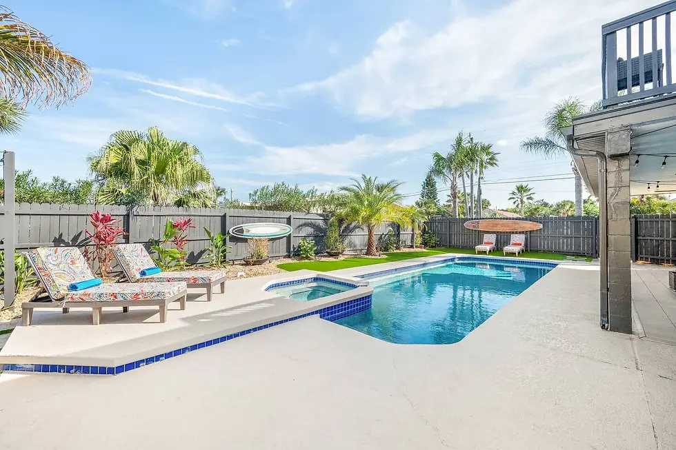 Resort-style backyard pool and spa with tropical landscaping for St. Augustine vacation rental pricing strategy analysis