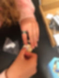 hands attaching a sticker