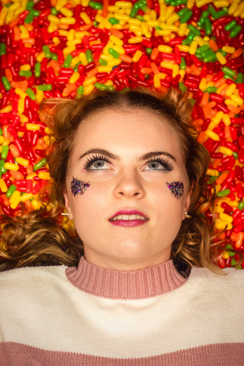 Senior Rep rolling her eyes while laying in some Mike & Ikes