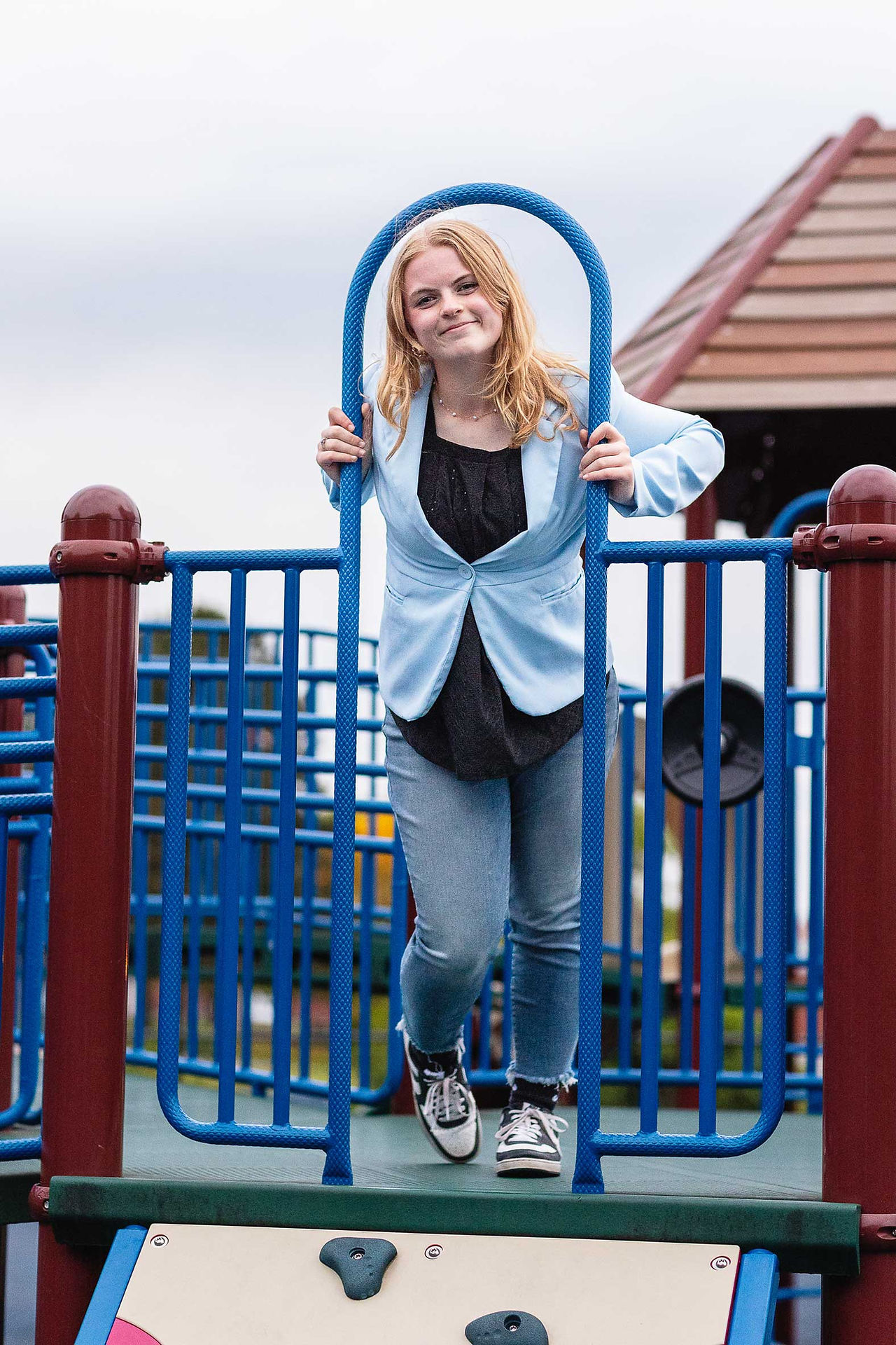 Senior girl posing on a playground