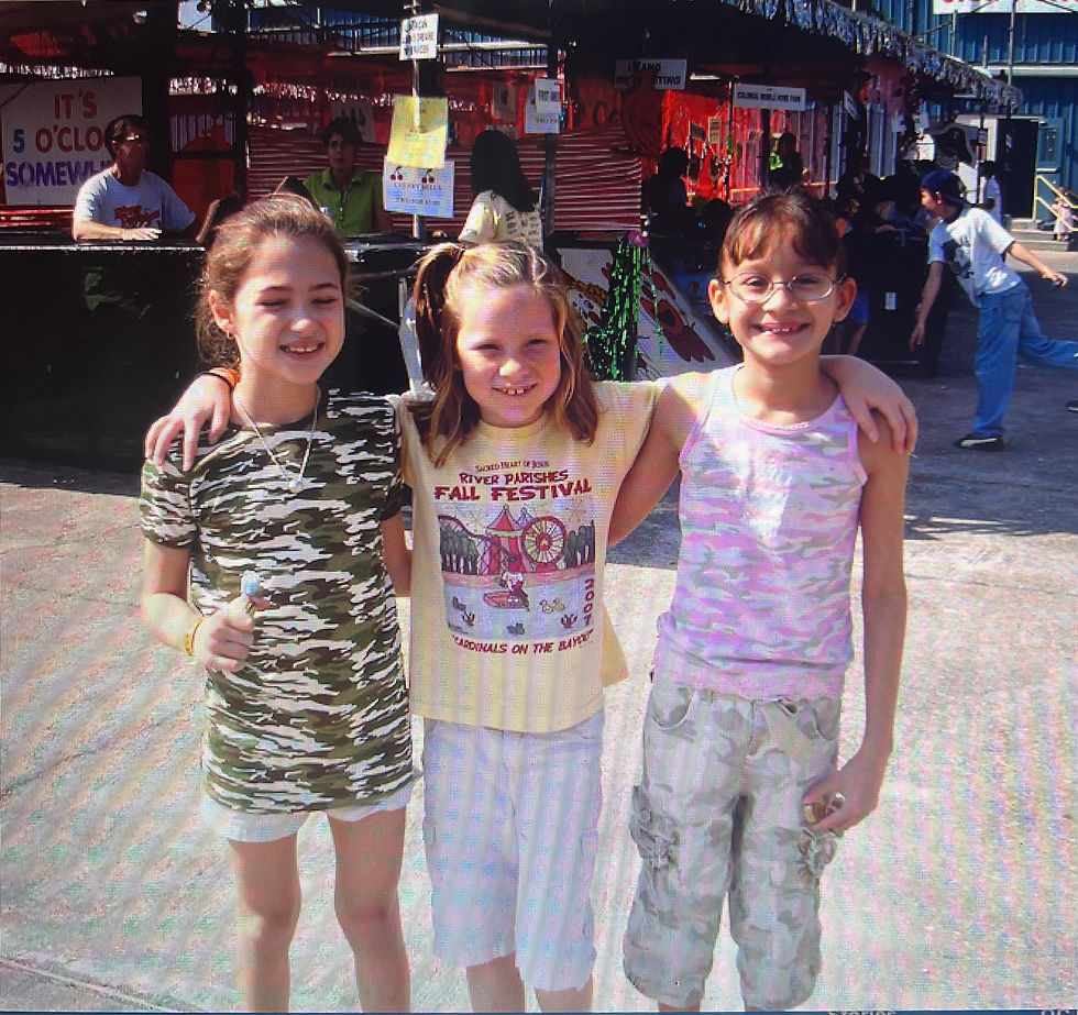 Spending time with childhood friends at the River Parishes Fall Festival at Sacred Heart of Jesus School in Norco. We always looked forward to this every November. (Taken in 2007).