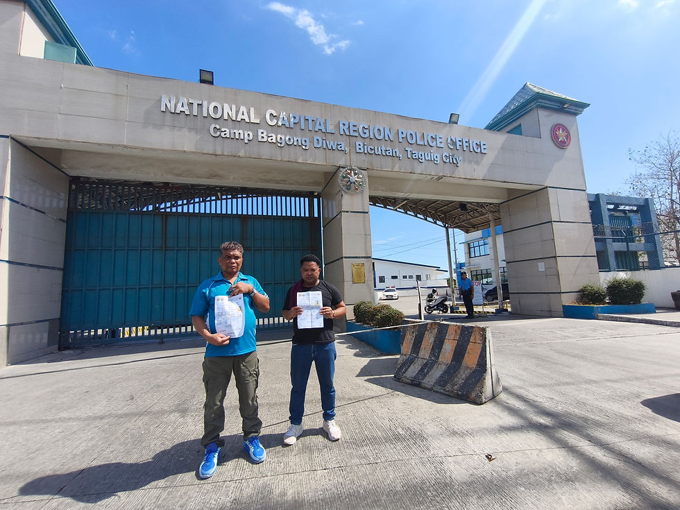 Dumagat farmers Avelardo "Dandoy" Avellaneda (left) and Rocky Torres (right) in front of Camp Bagong Diwa in Taguig City, May 9, 2026.