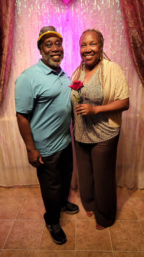 Social couple taking a picture during a party at Bravo Dance Studio.