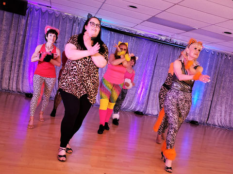 Advanced group dancers performing a showcase at Bravo Studio