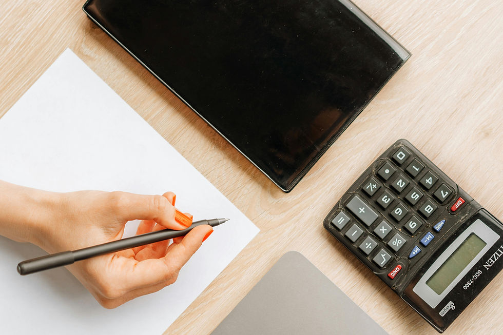 flat lay of computer and calculator
