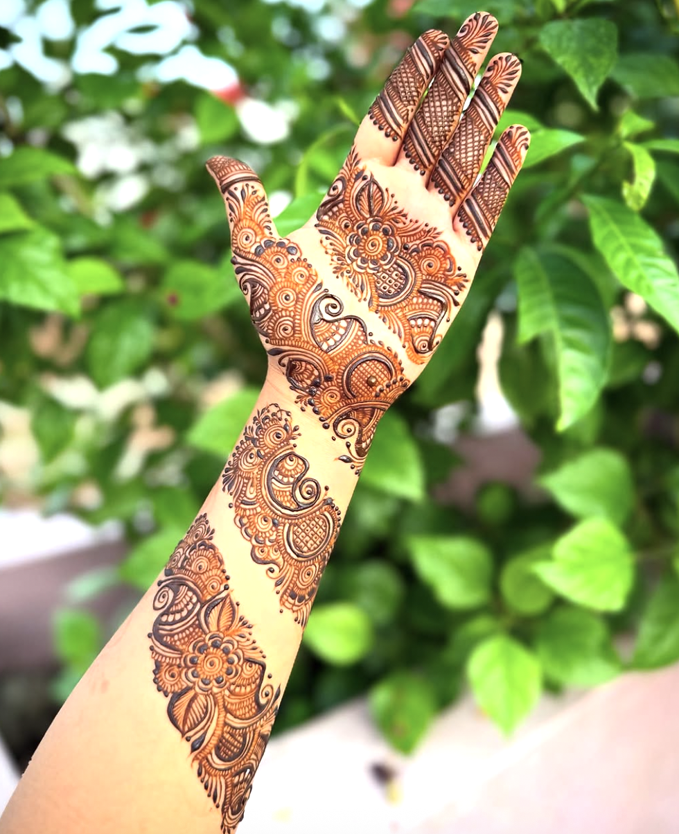 Arm-length mehndi with slanted floral sections