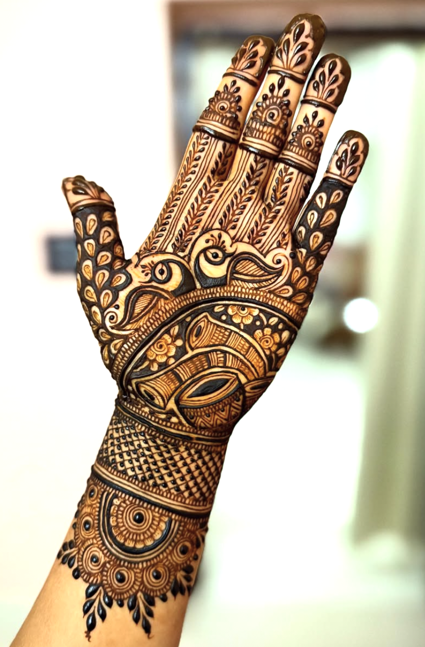 mehandi with peacock elements, floral designs, and heavy shading