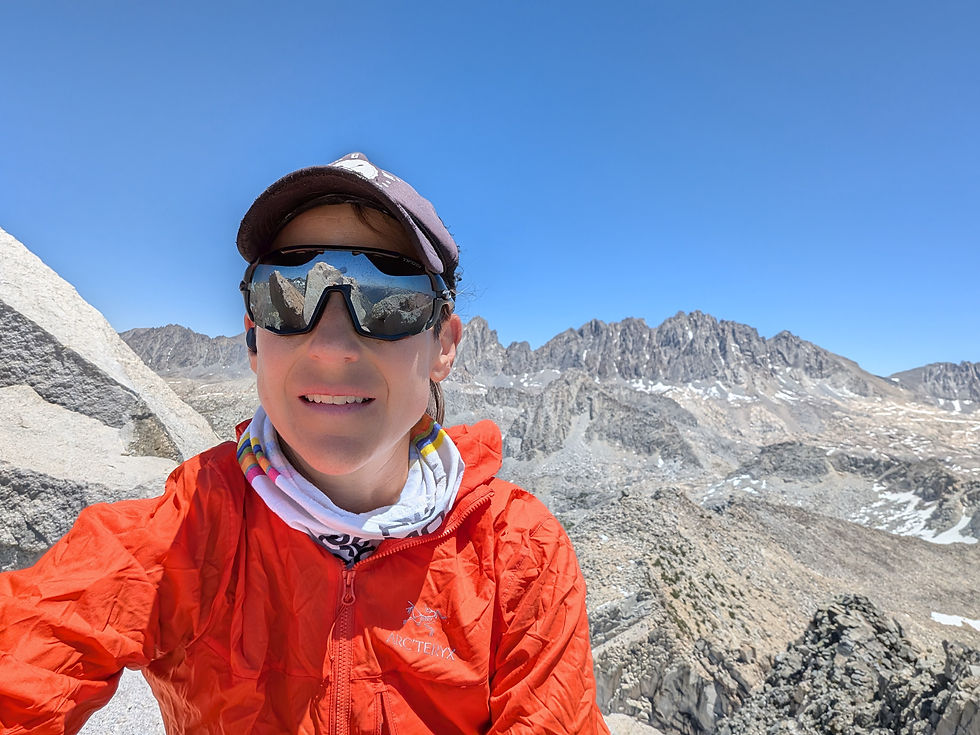 Writer on the summit with the Palisades in the background