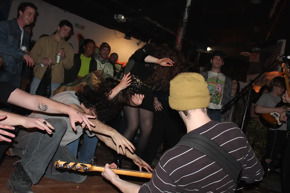 LoudFoxCult bassist Jackson Ciavattone shredding away as fans offer their bows. Source: Owen Armentrout
