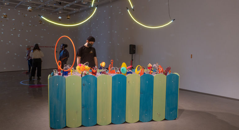 Large installation called Earthly Delights. Made with Neon, wood, glass, glitter. Various colors. 