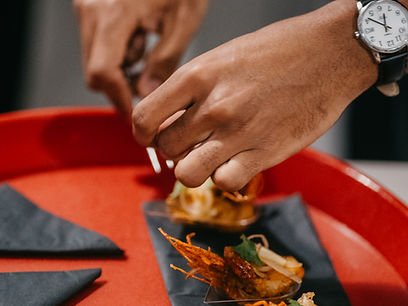 Chef plating a course